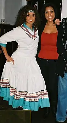 The woman on the left is wearing a "Squaw Dress."