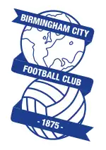 Badge of Birmingham City: a line-drawn globe above a football, with ribbon carrying the club name and date of foundation