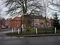 The bus stop bench and sign