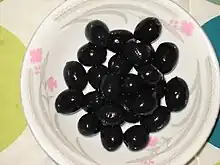 Black olives on a plate