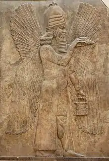 Deity representation on Assyrian relief. Blessing genie, about 716 BCE. Relief from the palace of Sargon II. Louvre AO 19865