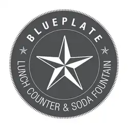 Circular graphic logo with a large star in the center as well as the text "Blueplate" above and "Lunch Counter & Soda Fountain" below