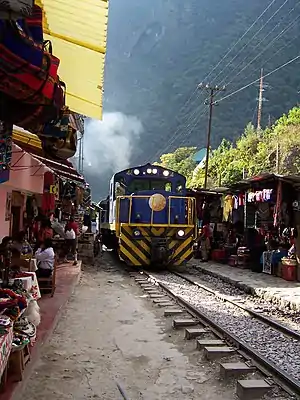 A train in a crowded area of Bolivia