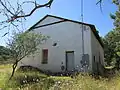 A large adobe building that was once part of the Bonanza Mine.