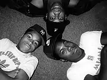 Boogie Down members in 1987, Scott La Rock (Nike hat), KRS-One, and D-Nice