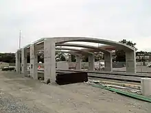 An arched concrete structure under construction