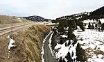 West portals of Bozeman Pass tunnels built by the Northern Pacific Railway. The original 1884 tunnel (abandoned) is on the right, while the newer 1945 tunnel is on the left (now used by BNSF).