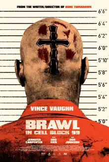 A person standing in front of a prison height chart. The back of a bald head has a crufix on it and blood spatter.