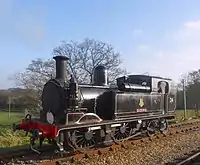 The railway's flagship locomotive, British Railways 0-4-4T W24 'Calbourne' runs round the train at Wootton