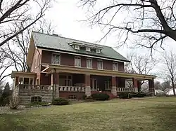 Photograph of Broadview Mansion, a two-and-a-half story, brick house with a broad veranda