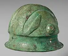 Colour photograph of a hemispherical helmet with deep brim