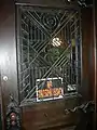 Wrought iron grille, carriage entrance door