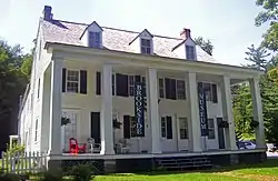 Front view of Brookside with colonnade at entranceway