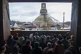 Buddhists praying on the occasion of Buddha Jayanti (during a renovation of Boudhanath temple)