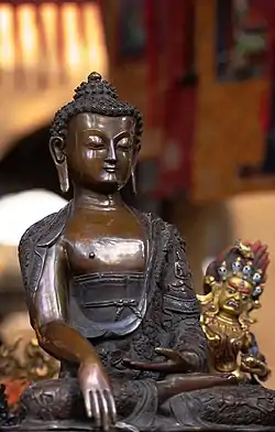 Photo of bronze statue of Buddha at the Sikkim Pavilion