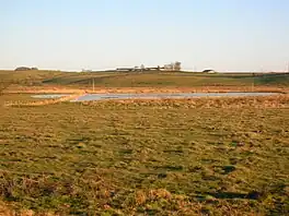 Fields flooded with a small lake or flash