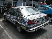 A Chevrolet Nova plastered all over with bumper stickers