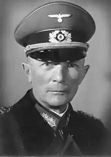 A portray of a man wearing a military uniform and peaked cap.