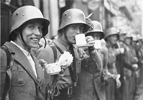 Volunteers of the Sudeten German Free Corps (German: Sudetendeutsches Freikorps) receiving refreshments from the local population in the city of Eger/Cheb)