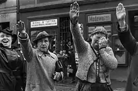 Ethnic Germans in the city of Eger (now Cheb) greeting Hitler with the Nazi salute after he crossed the border into the Czechoslovak Sudetenland on 3 October 1938