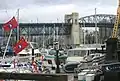 View of Kitsilano and central spans of Burrard Bridge, from dock level, marina, southwest quadrant