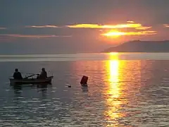 Two fishermen on a boat in the gulf