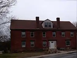 Butler Block, commercial and residential, 1800s building; part of the building houses the Linwood Post Office within the town limits of Uxbridge.