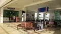 Station concourse above the platform area with the ticketing counter and the old wooden chairs which were previously used in the old Ipoh railway station.