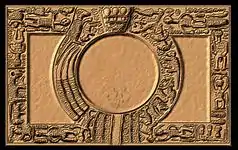 A tray with elaborately carved borders, placing a circle within a rectangle.