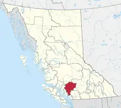 A map of British Columbia depicting its 29 regional districts and equivalent municipalities. One is highlighted in red.