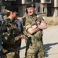 United Kingdom Maj. Gen. Rupert Jones, Deputy Commander – Strategy and Support, Combined Joint Task Force – Operation Inherent Resolve, (CJTF-OIR),speaks with a British explosive ordnance disposal trainer during a visit near Erbil, Iraq, 7 November 2016. CJTF-OIR is a multinational effort to weaken and destroy Islamic State in Iraq and the Levant operations in the Middle East region and around the world. (US Army photo by Sgt. Lisa Soy)