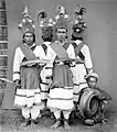 Tandako dancers and a musician in Pasere Maloku, Sulawesi.