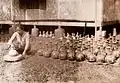 Creation of potter with a potter's wheel in Indonesia (c. 1930)