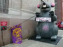 Image 10AFL–CIO unions protest outside Verizon headquarters in Philadelphia using a giant inflatable rat.