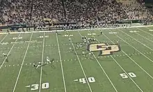 Cal Poly quarterback Sam Huard throws downfield during a win against Northern Colorado in the 2023 season.