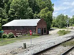 Former H. R. Justice store and post office in Calcis. Alabama State Route 25 and Norfolk Southern Railway to right of photo.