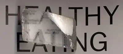 A crystal giving a double image of the text behind it