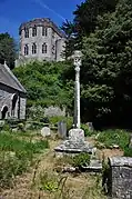 The churchyard cross, a Grade I listed structure and a scheduled monument