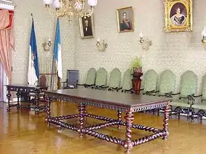 Main table in the noble hall, with paintings of the members of the Regency of Angra