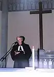 A pastor leads prayer in the Czech Brethren Church of John Amos Comenius for the International AIDS Candlelight Memorial (2001)