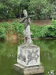 Statue of Cao Lỗ with the crossbow he built for An Dương Vương