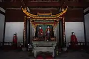 Interior view of the back hall, with the statue of Cao'e's parents in a pavilion, flanked by statues