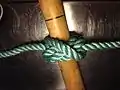 Final step of tying Cross constrictor knot: object through the 3 loops