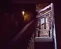 Ground floor exterior stairwell at Carl Street Studios. The hand-carved balusters and railings were executed by Torres and Edgar Miller.