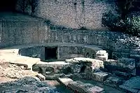 The water tank or castellum divisorum at Nîmes, into which the aqueduct emptied. The round holes were where the city's water supply pipes connected to the tank.