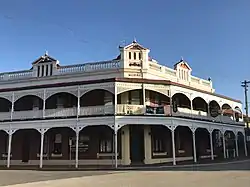 Castle Hotel, York; verandah and timber fretwork added c. 1905.