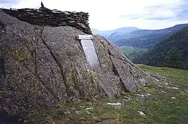 Castle Crag summit with the circular cairn and war memorial.