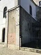 Section of cerca fernandina embedded in wall of Graça convent, at the site of Porta da Graça, looking into enclosure.