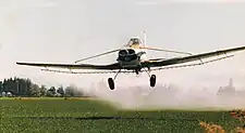 Spraying barley for rust fungus,New Zealand, 1979