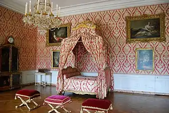 1755 Lit à la polonaise by Nicolas Heurtaut, with folding stools arranged before it, Bedchamber of the Dauphine at the Palace of Versailles. Note square frame under crown is covered with the same fabric.